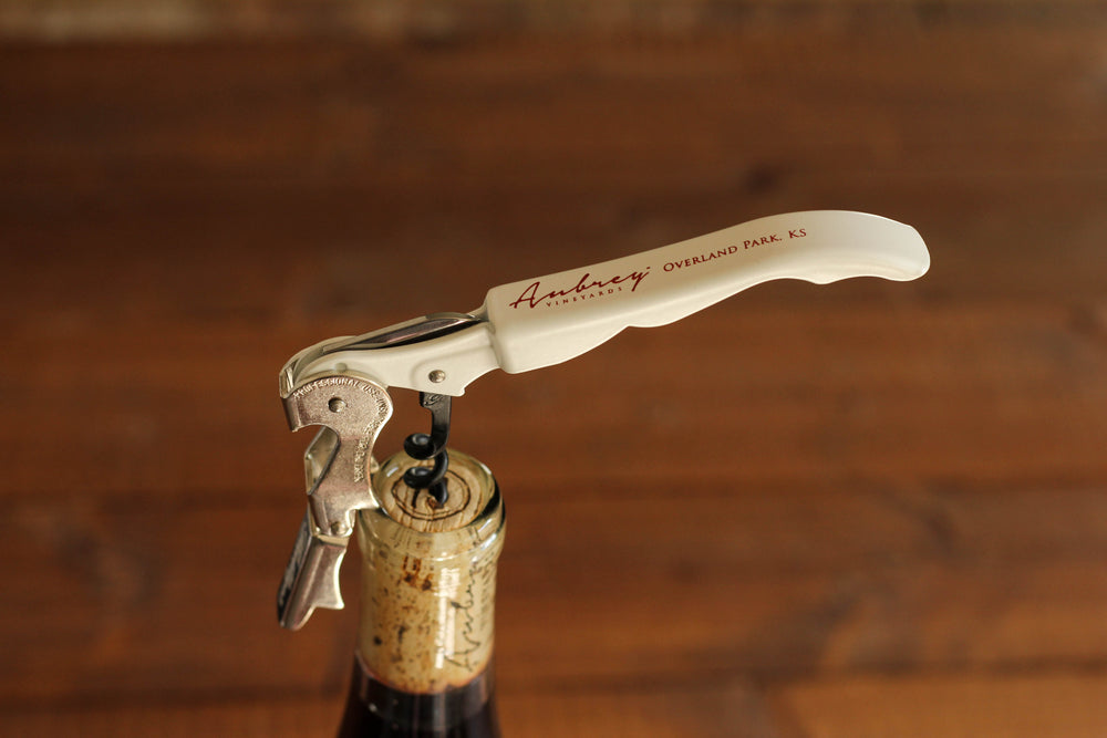 
                  
                    Load image into Gallery viewer, A close up on a white Aubrey Vineyards corkscrew. 
                  
                