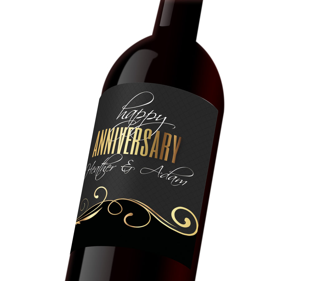 Black and gold custom wine label with white and gold text that reads, "Happy Anniversary Heather & Adam"