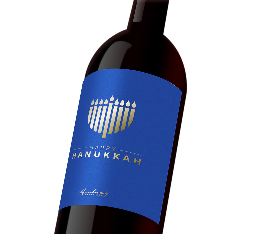 A blue custom wine label with a silver Menorah that reads, 