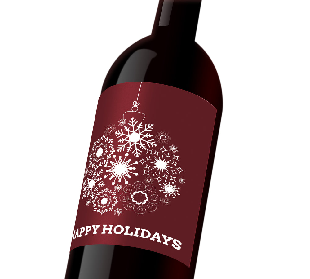 A maroon holiday custom label depicting a white holiday ornament made out of snowflakes. The label reads, 