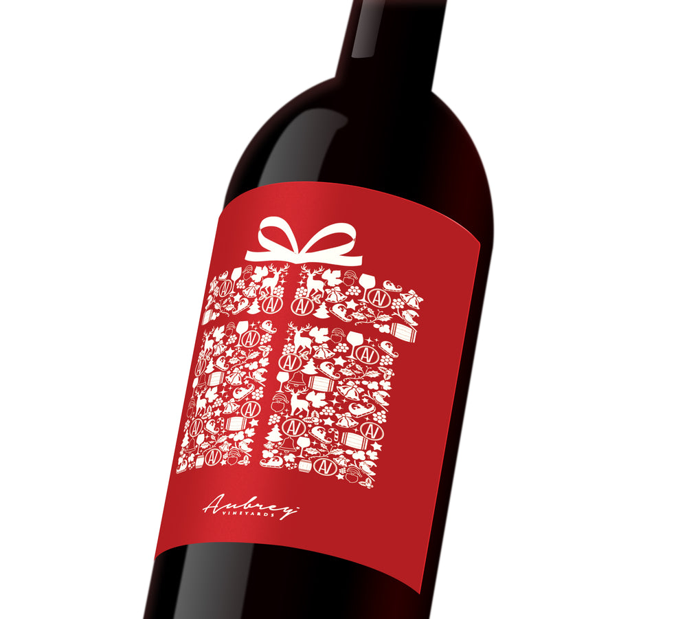 A red holiday custom wine label depicting a white present.