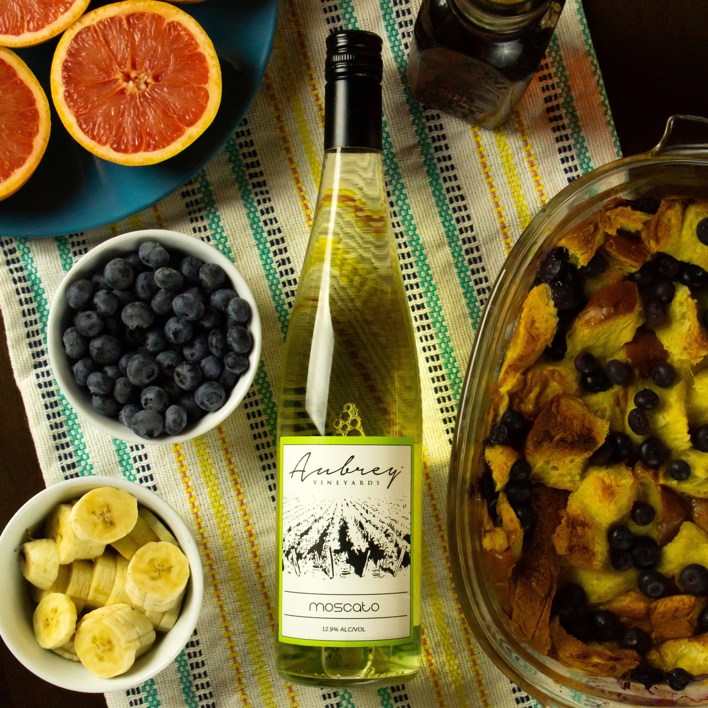 Aubrey Vineyards Moscato pictured with fruit and a blueberry pastry.