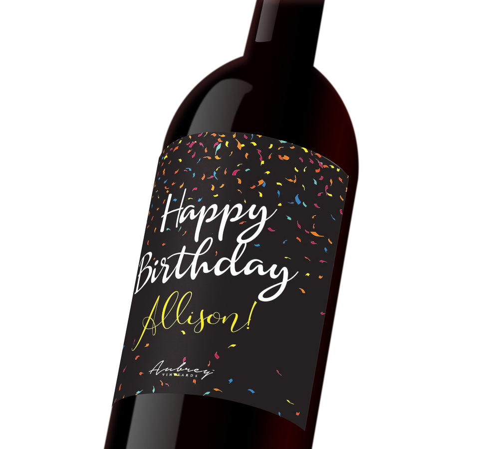 A black customizable wine label with colorful confetti that reads, 