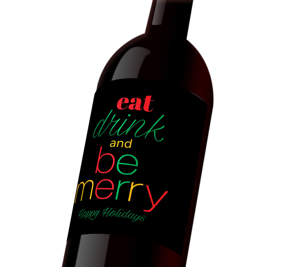 A black holiday wine label with red, green, and yellow text that reads, "Eat, drink, and be merry. Happy Holidays"