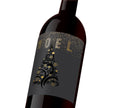 A black and gold holiday custom wine label that reads, "Noel".