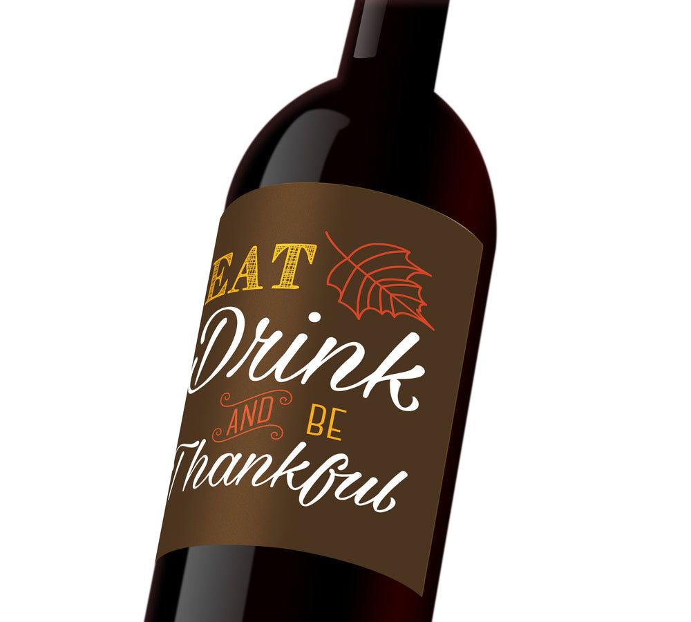 A brown Thanksgiving custom wine label that reads, "Eat, drink, and be thankful".